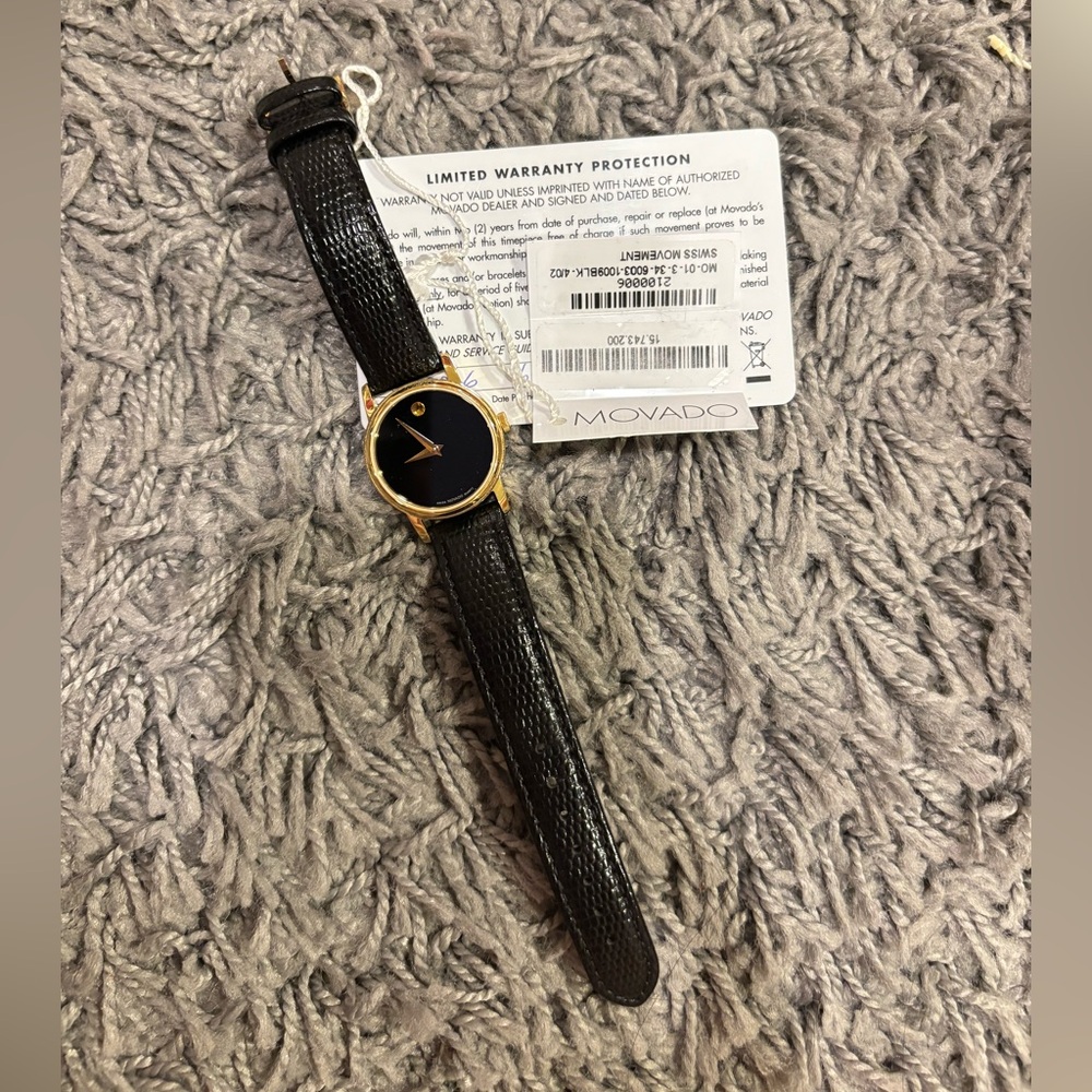 Movado Classic Black and Gold Timepiece